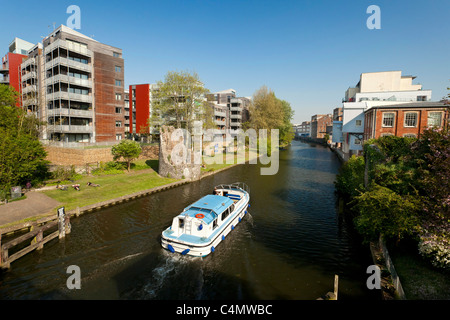 boat travelling along the river Wensum in Norwich, UK Stock Photo