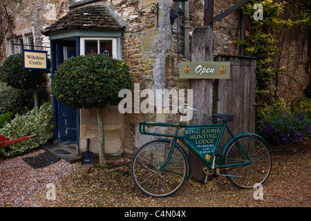 An old bicycle outside of King John's Hunting Lodge at Lacock Village in Wiltshire.