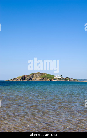 Vertical wide angle view across Bantham beach at high tide towards Burgh Island on a sunny day. Stock Photo