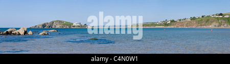 Horizontal panoramic view of Burgh Island and Bigbury-on-Sea on the South Devon coast on a sunny day. Stock Photo