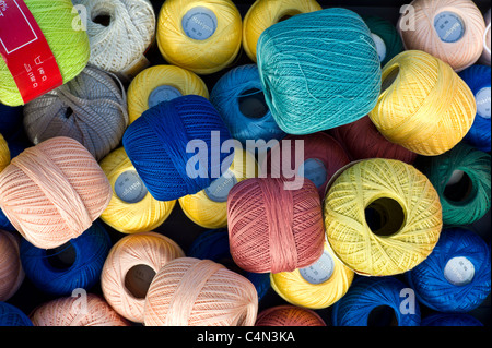 Cotton reels for crochet work on sale at street market in La Reole, Bordeaux region of France Stock Photo