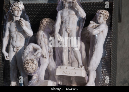 Small statues of Michelangelo's David wrapped in clear plastic for sale to tourists in Florence, Italy. Stock Photo