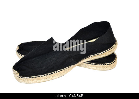Black pair of espadrilles on a white background Stock Photo