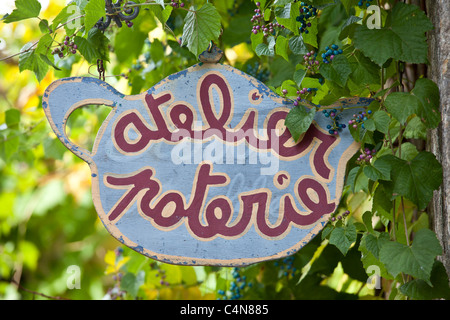 Pottery sign for craft shop in quaint town of Castelmoron d'Albret in Bordeaux region, Gironde, France Stock Photo