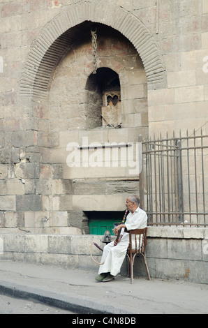 old man smoking in cairo egypt Stock Photo