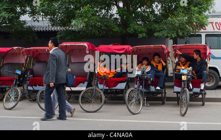 Beijing, China, Small Group People, Small Business, Tourist Rickshaw rides, on Street, near Temple of Heaven Monument, Chinese workers, old city street Stock Photo