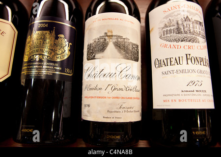 Fine wines Chateau Canon, Chateau Fonplegade, Chateau Palmer Medoc in wine merchants shop in St Emilion, Bordeaux, France Stock Photo