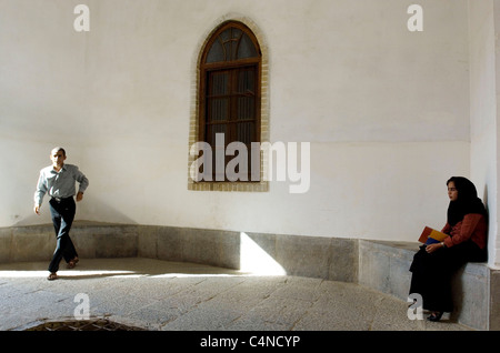 Young woman and man at Jameh Mosque (Friday mosque) in Yazd, Iran Stock Photo