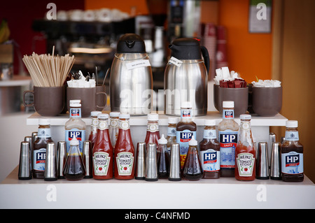 Display of various condiments at a cafe. Stock Photo