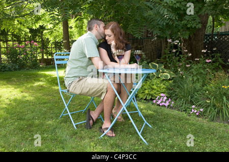 Young couple in the garden on a summer day, Ontario Stock Photo