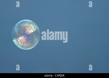 Bubble floating against blue sky Stock Photo