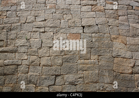 Hand made Grey old stone wall in india. Stock Photo