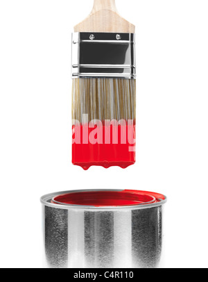Painting brush dipped in can of red paint isolated on white background Stock Photo