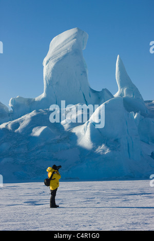 Tourist photographing iceberg, Snow Hill Island, Antarctica Stock Photo