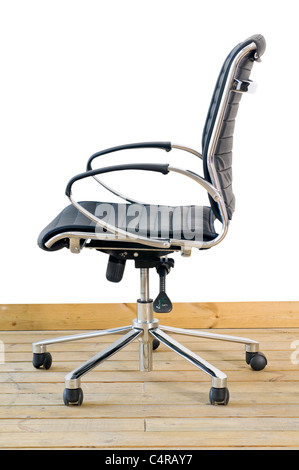 modern black leather office chair on wood floor over white background Stock Photo