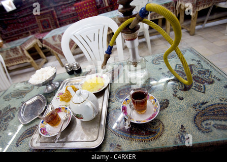 Azadegan tea house, Isfahan, Iran with cakes, sweets, tea, water pipe Stock Photo