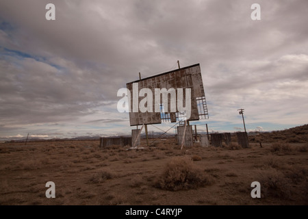 old abandoned drive-in movie theater on a cloudy day desert Stock Photo