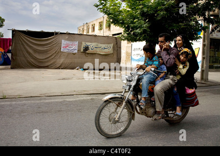 Family riding a motorcycle between Gorgan and Gonbad-e Qabus (Gonbad-e Kavus), Golestan province, Iran Stock Photo