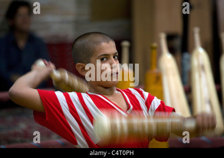 Man and boy in Yazd practising zurkhaneh (traditional Iranian dance/sports) Stock Photo