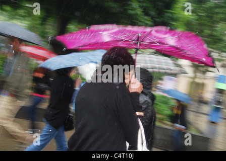 people in the rain in town centre Barcelona Europe Stock Photo