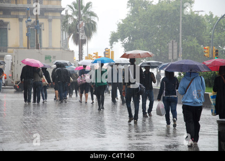 people in the rain in town centre Barcelona Europe Stock Photo