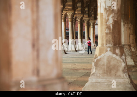 Girl walking through Diwam-i-Am (Hall of Public Audiences) in Agra Fort, Agra, Uttar Pradesh, India Stock Photo