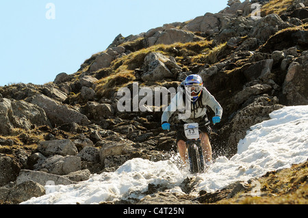 Red Bull sponsored professional trials bike rider Danny MacAskill races his mountain bike at a downhill event in Scotland Stock Photo