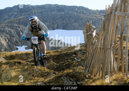 Red Bull sponsored professional trials bike rider Danny MacAskill races his mountain bike at a downhill event in Scotland Stock Photo