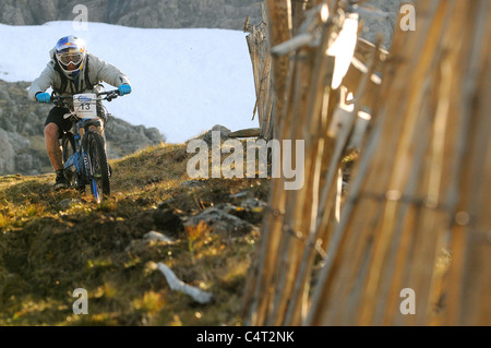 Red Bull sponsored professional trials bike rider Danny MacAskill races his mountain bike at a downhill event in Scotland Stock Photo