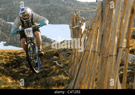 Red Bull sponsored professional trials bike rider Danny MacAskill races his mountain bike at a downhill event in Scotland Stock Photo