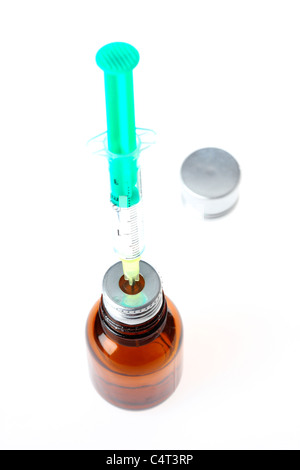 Injection cannula, medical syringe, filling a syringe with a medicament from a vial. Stock Photo