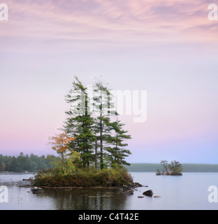 Small Islands On A Slightly Foggy Evening At Moose Pond, Maine, USA Stock Photo