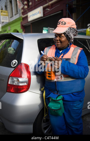 Marshal collecting parking fee in Cape Town South Africa Stock Photo