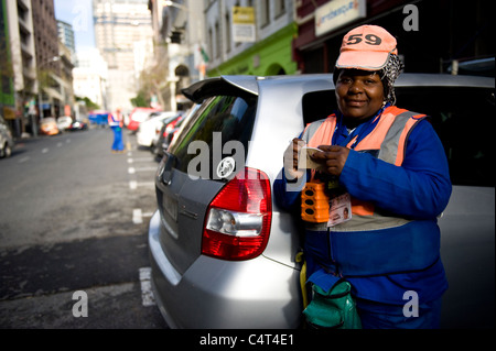 Marshal collecting parking fee in Cape Town South Africa Stock Photo