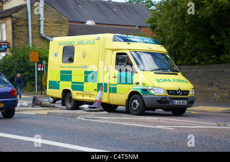 Ambulance attending an emergency in Huddersfield, West Yorkshire. Stock Photo