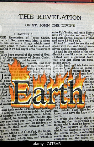 A conceptual image of Armageddon with the word Earth in flames overlaid on the Bible's Book of Revelation. Stock Photo