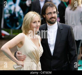 English author JK Rowling and her husband Dr Neil Murray arrive at the premier of 'Harry Potter and the Order of the Phoenix' Stock Photo