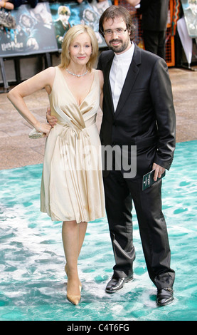 English author JK Rowling and her husband Dr Neil Murray arrive at the premier of 'Harry Potter and the Order of the Phoenix' Stock Photo