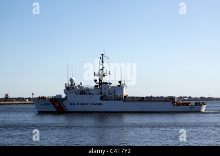 The United States Coast Guard cutter arrives back in Boston Harbor. Stock Photo