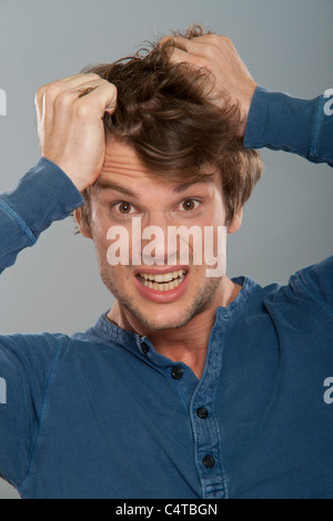 Man with Hands on Head Stock Photo
