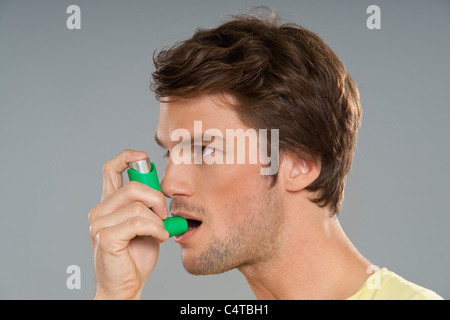 Man Using Inhaler Stock Photo