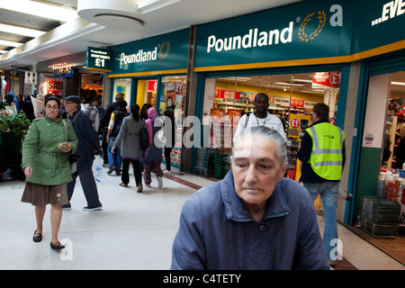 Pound shops in the Stratford Shopping Centre. This area has a few bargain shops as well as regular stores. Stock Photo