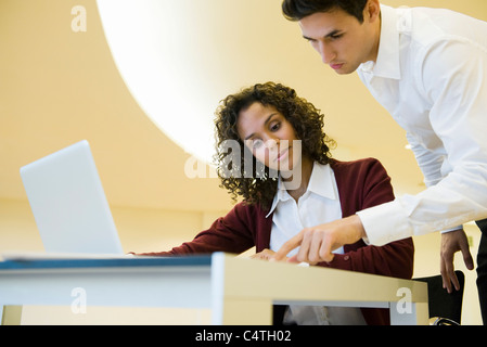Colleagues looking at documents together Stock Photo