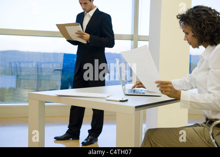 Executive working on laptop computer Stock Photo