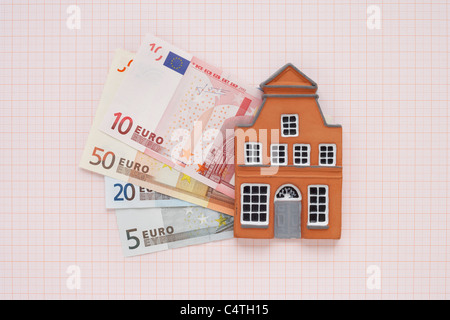 House and Euros on Graph Paper Stock Photo