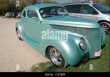 A beautiful light green coloured 1938 five window Ford coupe classic American car parked in Avebury, Wiltshire. April 2011 Stock Photo