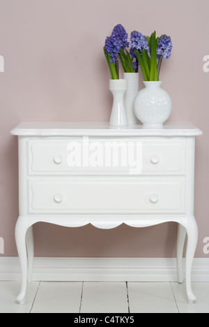 Hyacinths in Vases on Dresser Stock Photo