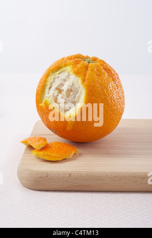 Partially Peeled Orange Stock Photo