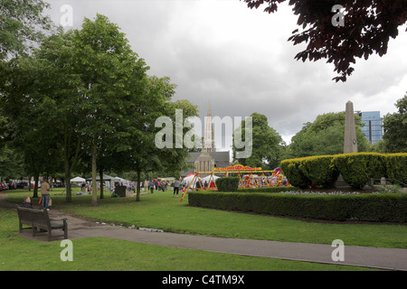 Local people enjoy the fun off the fair in the public park in Turnham Green in the west London district of Chiswick. Stock Photo