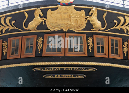 View looking up at the stern (rear) windows and Bristol coat of arms on Brunel's SS Great Britain in Bristol Dock, Bristol, UK. Stock Photo